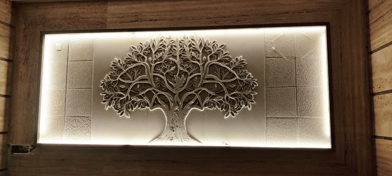 Sculptural tree relief surrounded by concealed backlighting